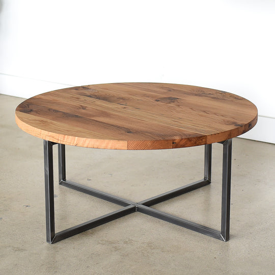 Circular wood coffee table in Reclaimed Oak / Clear & Blackened Metal 