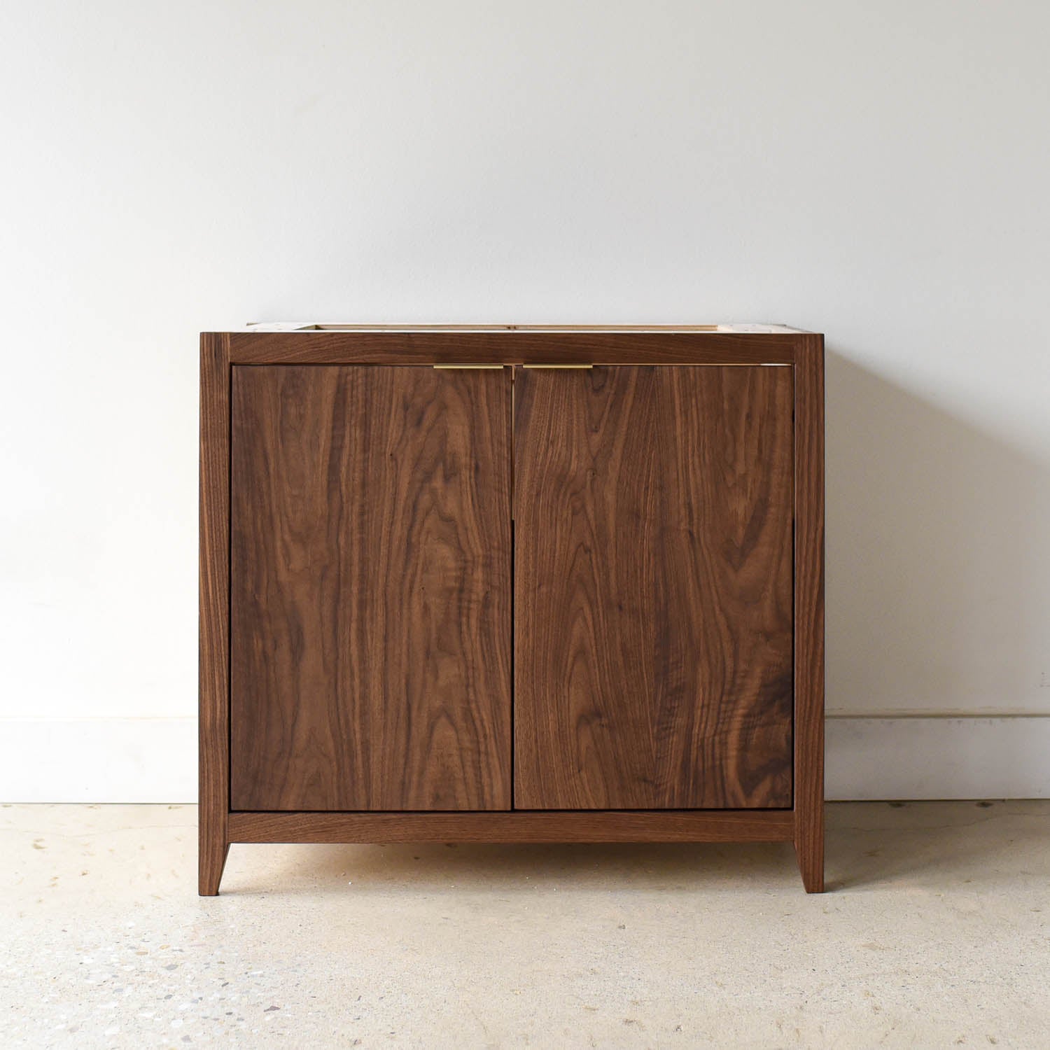 Mid-Century Modern 2-Door Single Sink Pictured in Walnut / Clear