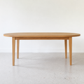 Oval Tapered Leg Dining Table Pictured in White Oak Clear