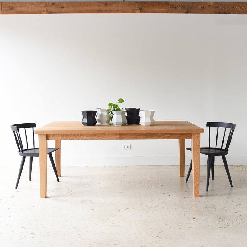 Extendable Tapered Leg Dining Table Pictured In White Oak Clear