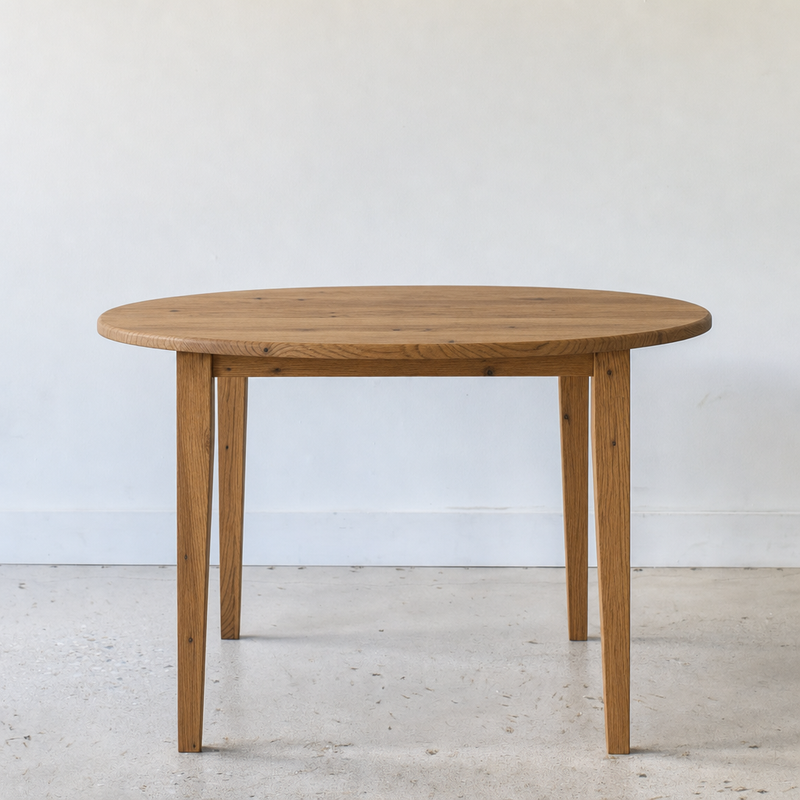 Round Tapered Leg Dining Table Pictured in Reclaimed Oak Clear