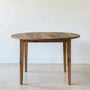 Round Tapered Leg Dining Table Pictured in Reclaimed Oak Textured