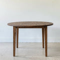 Round Tapered Leg Dining Table Pictured in Reclaimed Oak Walnut