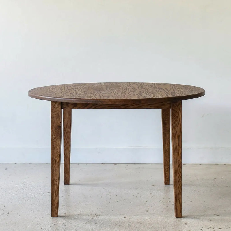 Round Tapered Leg Dining Table Pictured in Reclaimed Oak Walnut