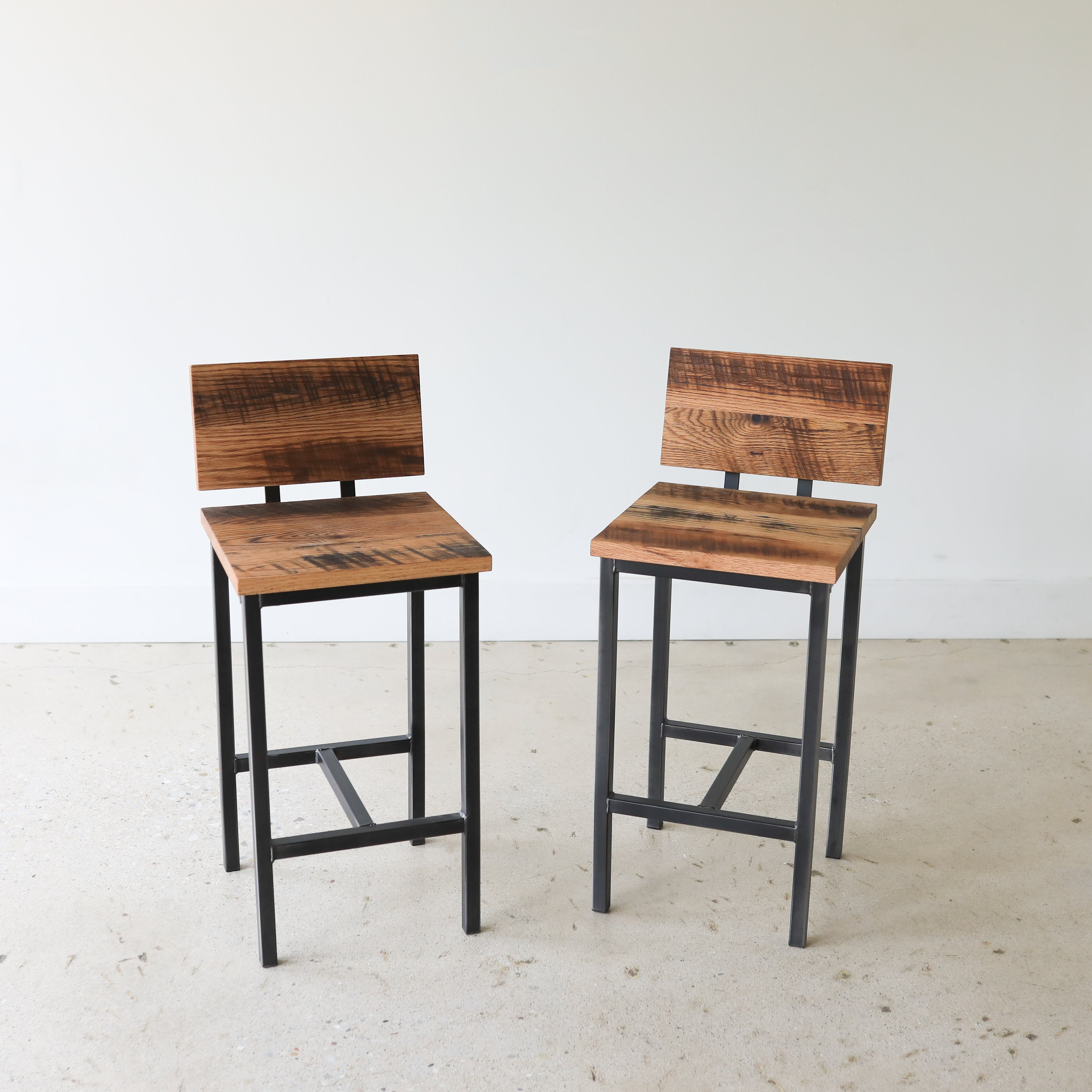 Industrial Modern Low Back Stool Pictured In Reclaimed Oak Textured & Blackened Metal