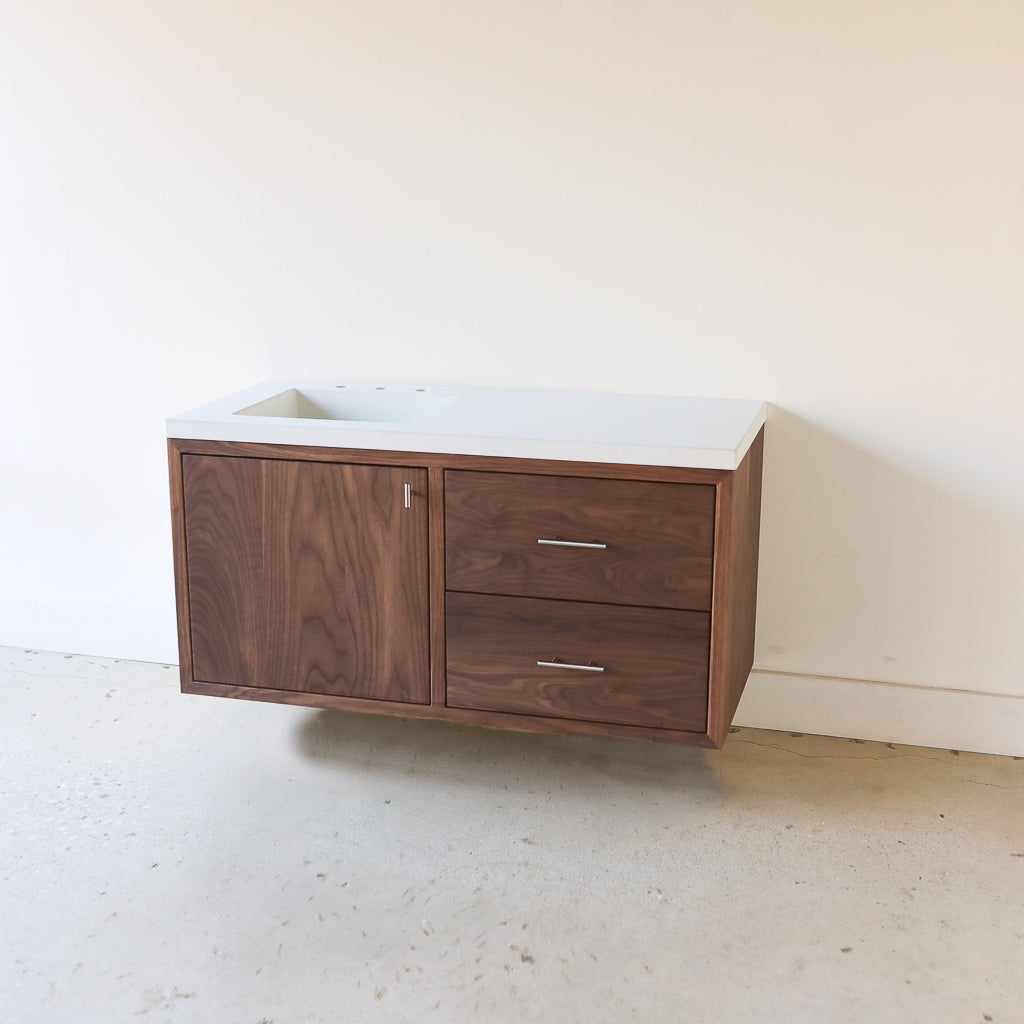 Wood Floating Vanity / Offset Single Sink Pictured in Walnut Clear & White Concrete Top