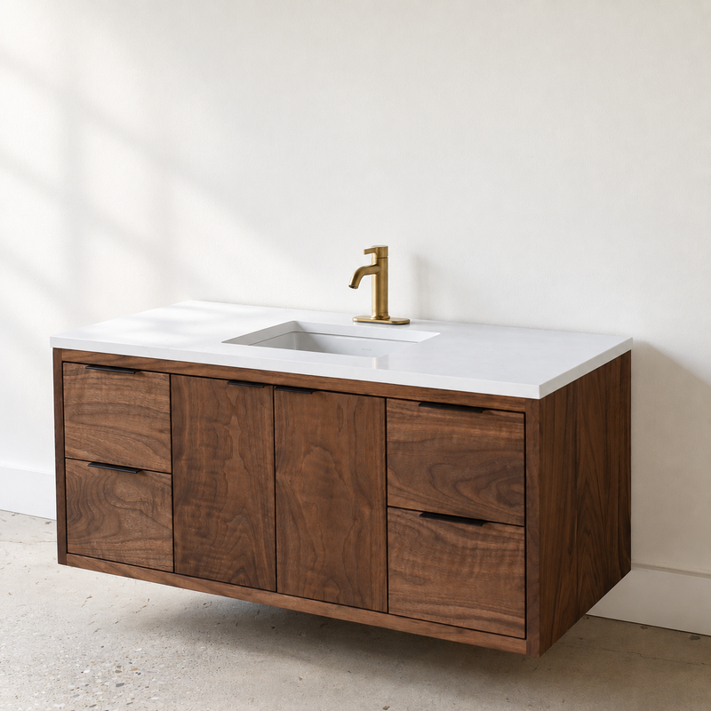 Our floating solid walnut bathroom vanity paired with the soft white quartz vanity top, and an undermount rectangular sink by Kohler. 