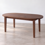 Oval Tapered Leg Dining Table Pictured in Walnut Clear