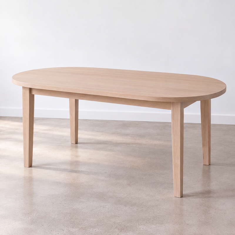 Oval Tapered Leg Dining Table Pictured in White Oak Natural