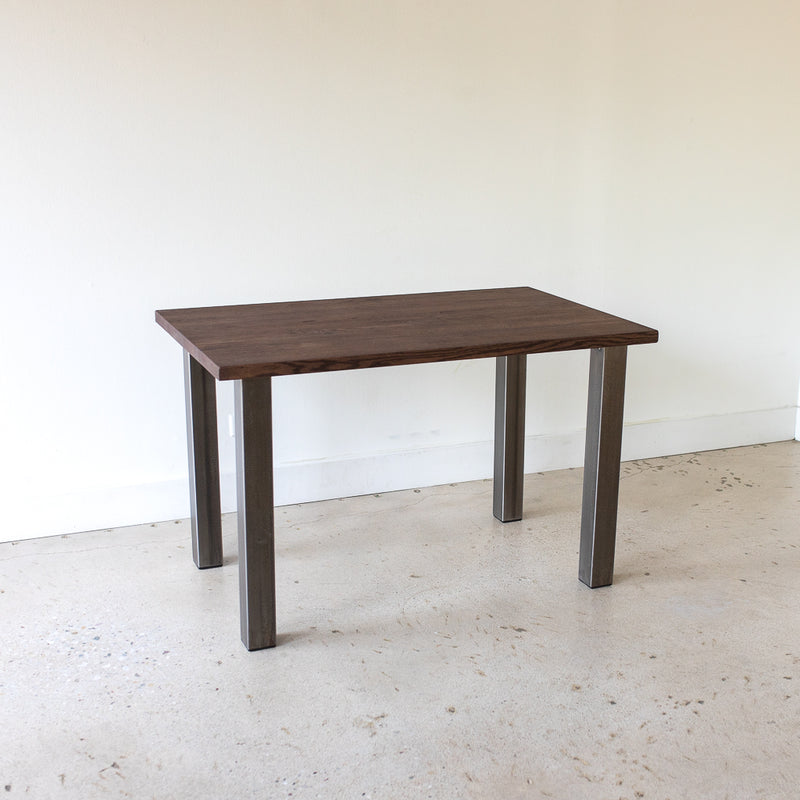 Industrial Post Leg Dining Table Pictured In Reclaimed Oak Walnut &amp; Blackened Metal Legs