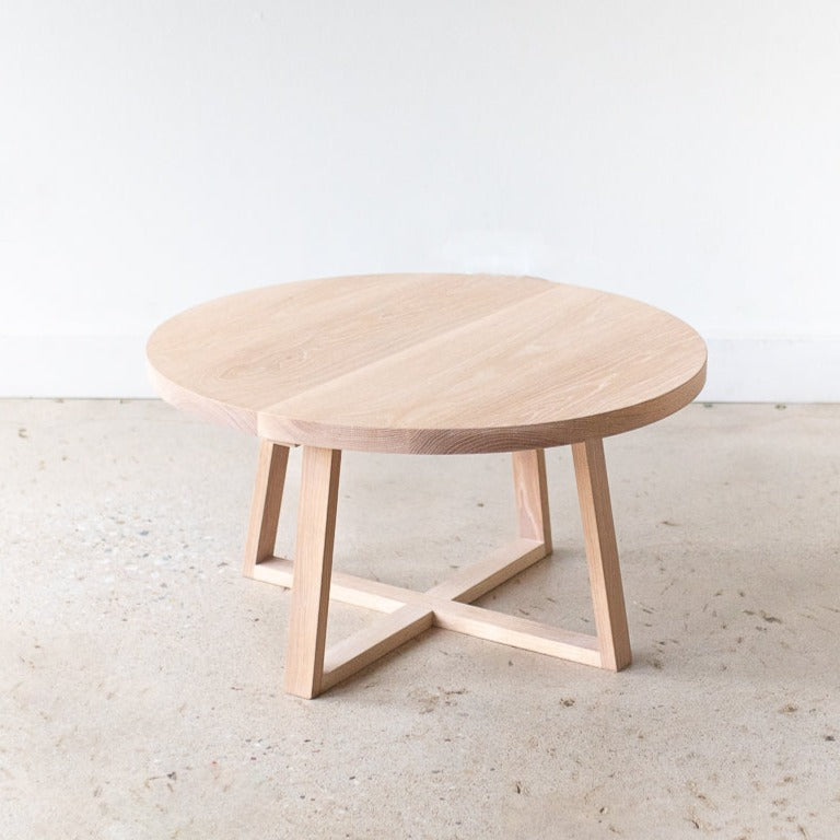 Round Solid Wood Coffee Table Pictured in White Oak/ Natural