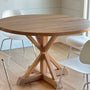 A lovely customer's home featuring  our Round Solid Wood Pedestal dining table with four white chairs.