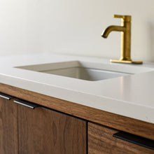 Showcasing the 1.5 inch thick soft white quartz vanity top with straight, slightly softened, rounded corner edge profile. 

