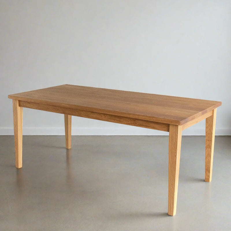Slim Tapered Leg Dining Table Pictured in White Oak  Clear