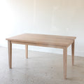 Slim Tapered Leg Dining Table Pictured in White Oak Natural