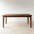 Plank Tapered Leg Dining Table pictured in Walnut Clear