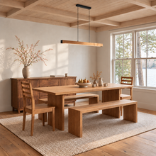 A warm wood dining room set with our Rounded Corner Timber Dining Table in White Oak Clear. Featuring matching tapered leg chairs, waterfall benches, and our Prairie Storage Cabinet.