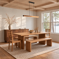 A warm wood dining room set with our Rounded Corner Timber Dining Table in White Oak Clear. Featuring matching tapered leg chairs, waterfall benches, and our Prairie Storage Cabinet.
