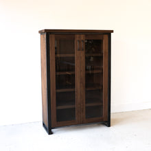 Wood + Glass Double Door Cabinet Pictured In Walnut Clear &amp; Blackened Metal