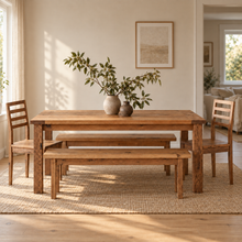 Our farmhouse solid wood dining table set in a bright, modern dining room with matching wood chairs and benches.