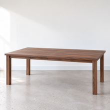 Farmhouse Extendable Dining Table Pictured in Walnut Clear.