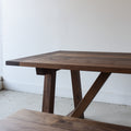 Farmhouse Trestle Dining Table Pictured In Walnut Clear Featured with our &lt;a href=&quot;/products/trestle-wood-dining-bench&quot;&gt;Trestle Wood Bench&lt;/a&gt; in Walnut Clear