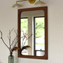 Frances solid wood wall mirror pictured in Walnut Clear with rounded corners, handcrafted by Hans Studio