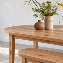 Close up of our Oval Tapered Leg Dining Table Pictured in Reclaimed Oak Clear