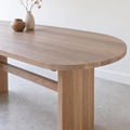 Detailing racetrack curve and hand sanded edges on our white oak natural tabletop. 