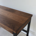 2-Drawer Modern Wood + Metal Desk Top Detail Pictured in Walnut Clear and Blackened Metal