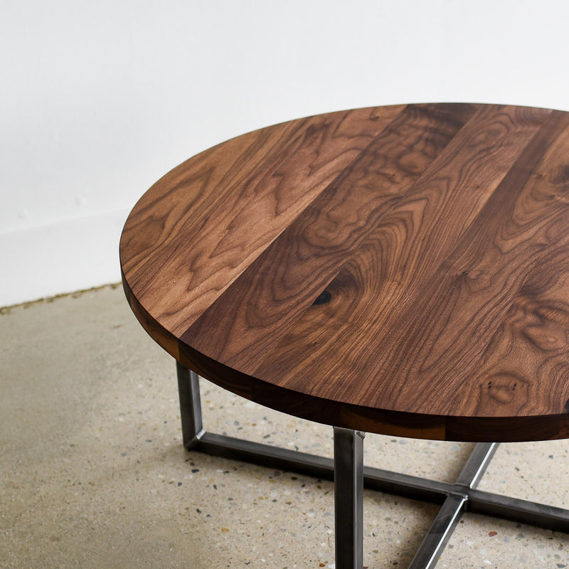 Round Modern Coffee Table Pictured in Walnut / Clear &amp; Blackened Metal