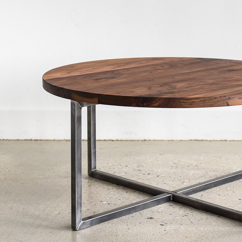 Round Modern Coffee Table Pictured in Walnut / Clear &amp; Blackened Metal