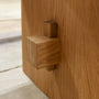 Close-up of a wooden joinery on our Modern Timber Frame Dining Table. Pictured in White Oak Clear.