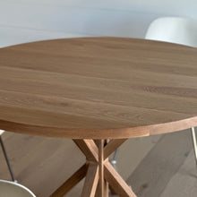 A lovely customer's home featuring  our Round Solid Wood Pedestal dining table.