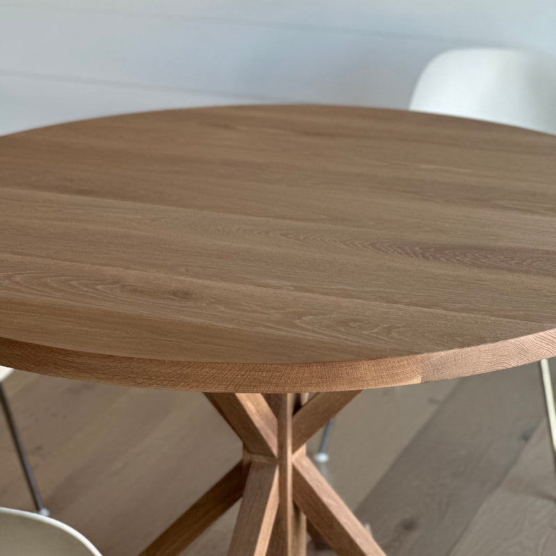 A lovely customer's home featuring  our Round Solid Wood Pedestal dining table.