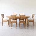 Oval Tapered Leg Dining Table  set with six matching tapered leg chairs.