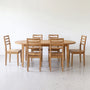 Oval Tapered Leg Dining Table  set with six matching tapered leg chairs.