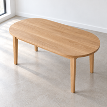 An overhead view of our Oval Tapered Leg Dining Table with our white oak clear finish.
