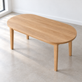 An overhead view of our Oval Tapered Leg Dining Table with our white oak clear finish.
