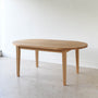 Oval Tapered Leg Dining Table Pictured in White Oak / Clear