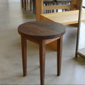 Round Taper Leg Accent Table Pictured In Walnut Clear