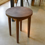 Round Taper Leg Accent Table Pictured In Walnut Clear