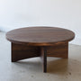 Sculptural Round Wood Coffee Table Pictured in Walnut / Clear