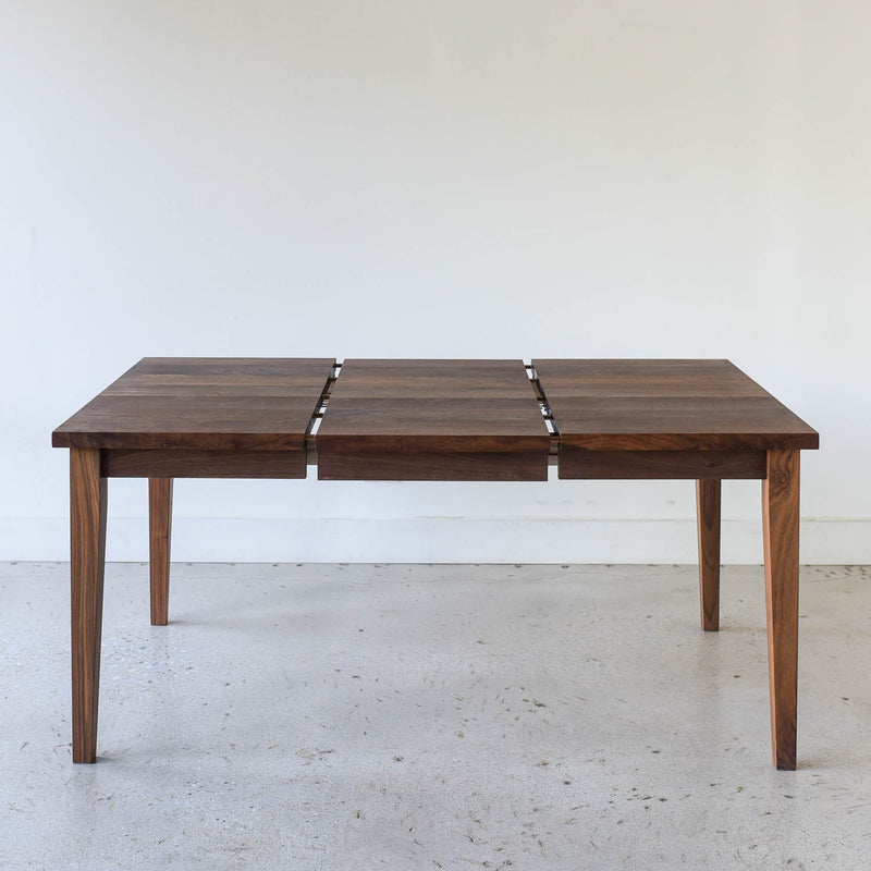 Extendable Slim Tapered Leg Dining Table Pictured in Walnut Clear - Leaf Insert