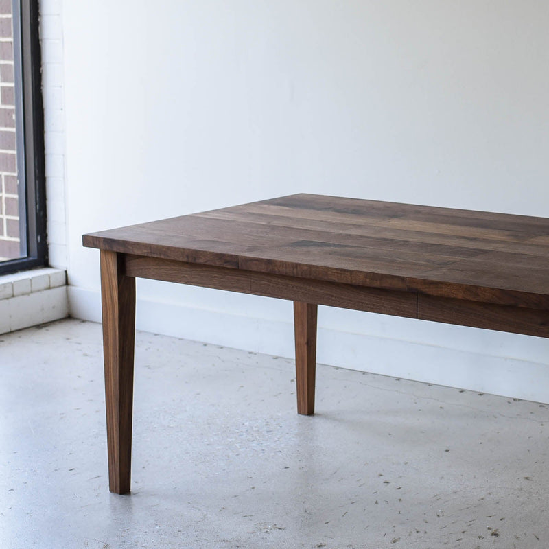 Extendable Slim Tapered Leg Dining Table Pictured in Walnut Clear