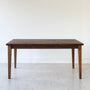Extendable Slim Tapered Leg Dining Table Pictured in Walnut Clear