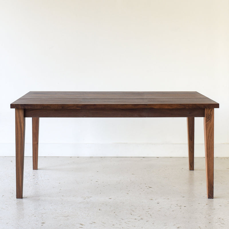 Slim Tapered Leg Dining Table Pictured In Walnut Clear
