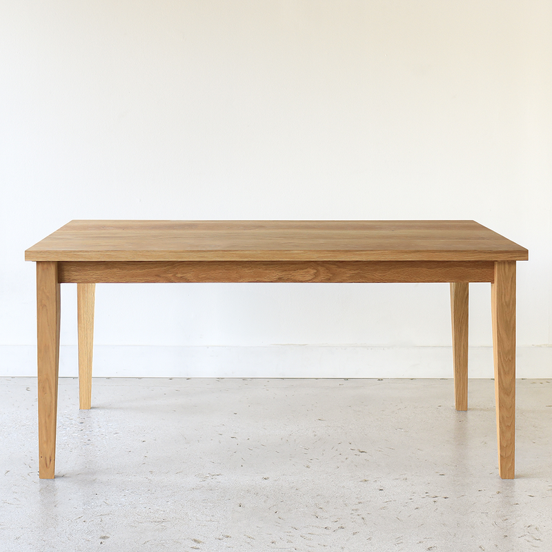Slim Tapered Leg Dining Table Pictured In White Oak Clear