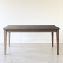 Slim Tapered Leg Dining Table Pictured In White Oak Gray