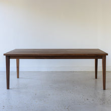 Slim Tapered Leg Dining Table Pictured In Walnut Clear